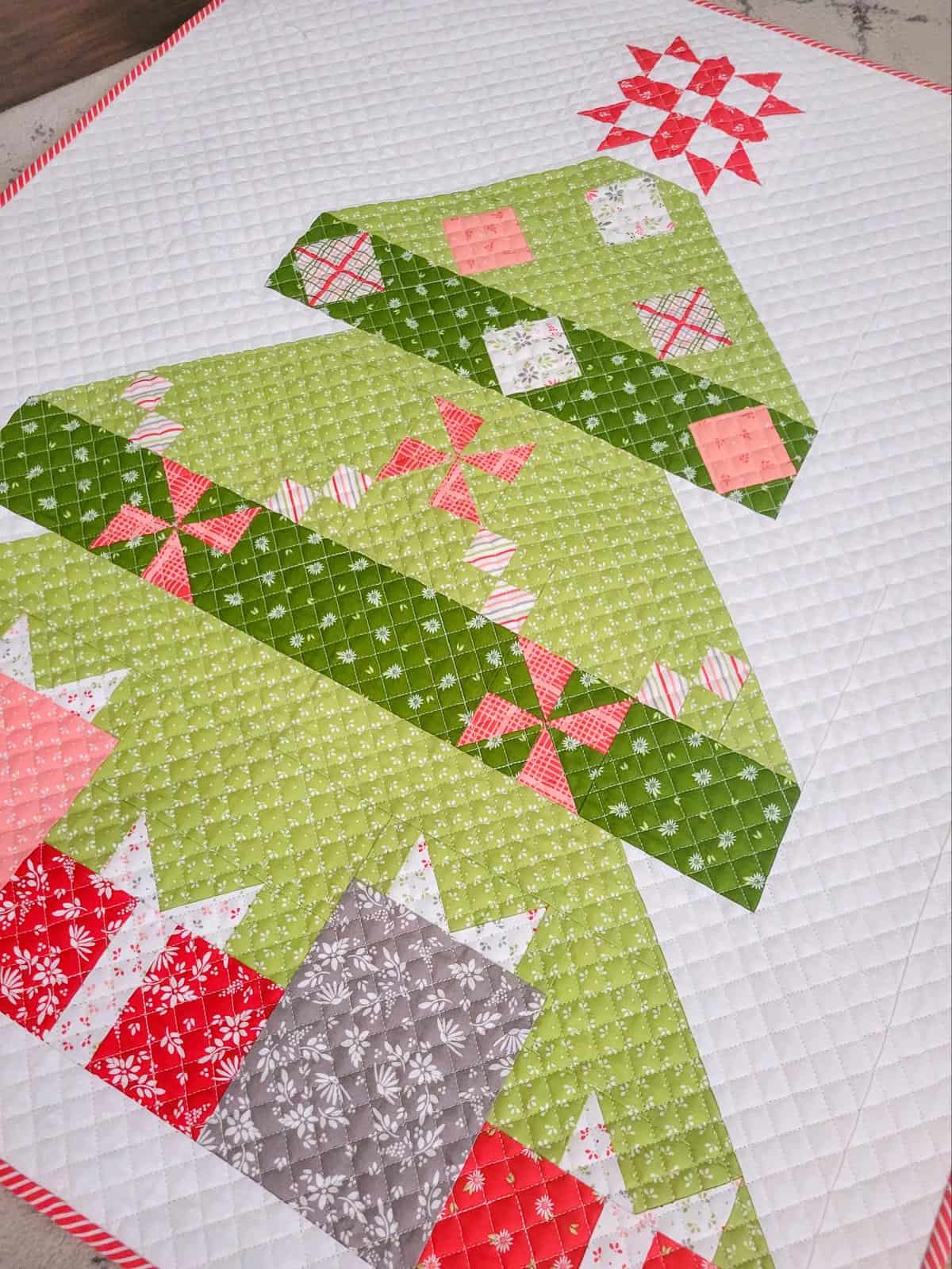 Patchwork Christmas Tree Wall hanging pieced by Sherri from A Quilting Life