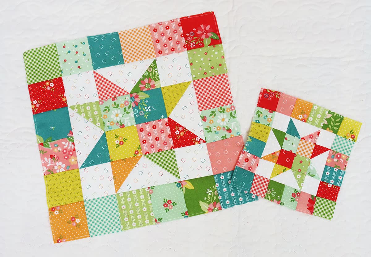 Scrappy patchwork star quilt blocks in green, aqua, teal, orange, pink, red, and green fabrics