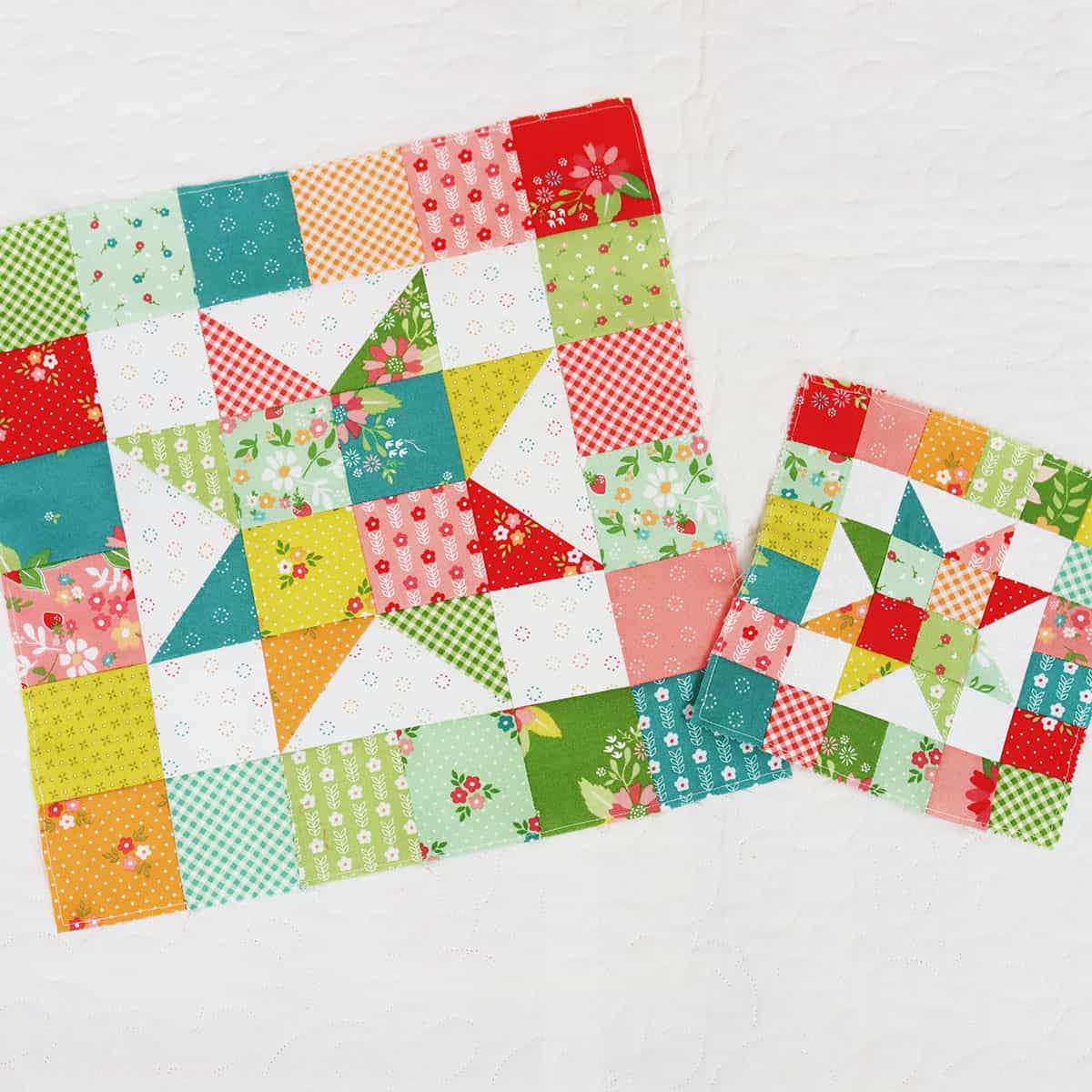 Scrappy patchwork star quilt blocks in green, aqua, teal, orange, pink, red, and green fabrics