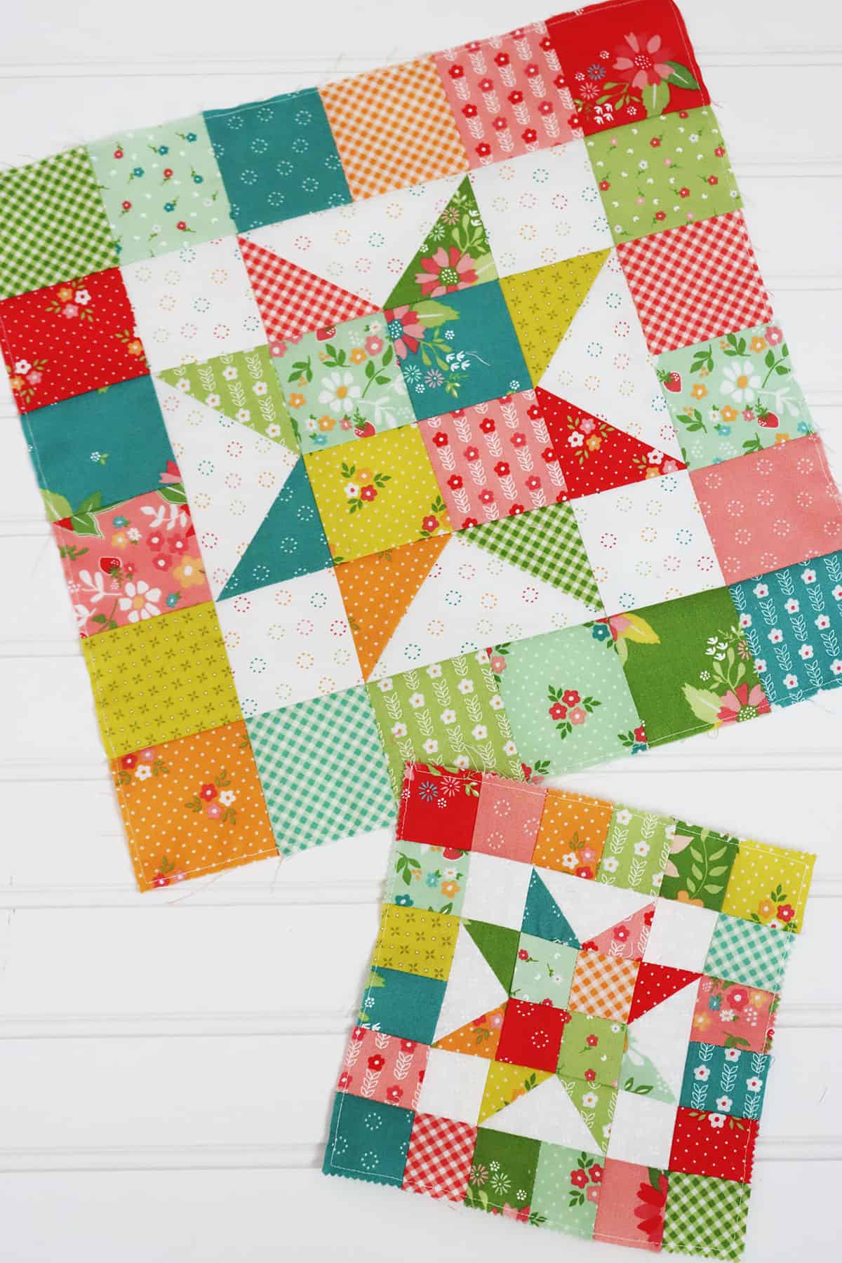 Scrappy patchwork star quilt blocks in green, aqua, teal, orange, pink, red, and green fabrics