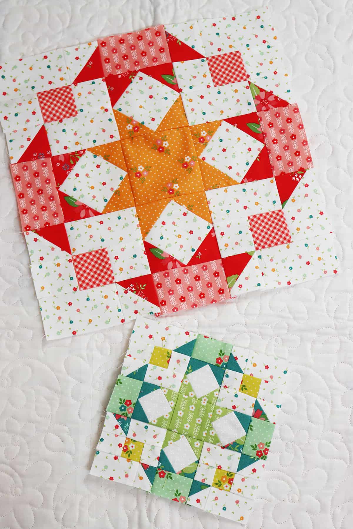 Large and small star design patchwork blocks in bright colors with a center star surrounded by four half star designs.