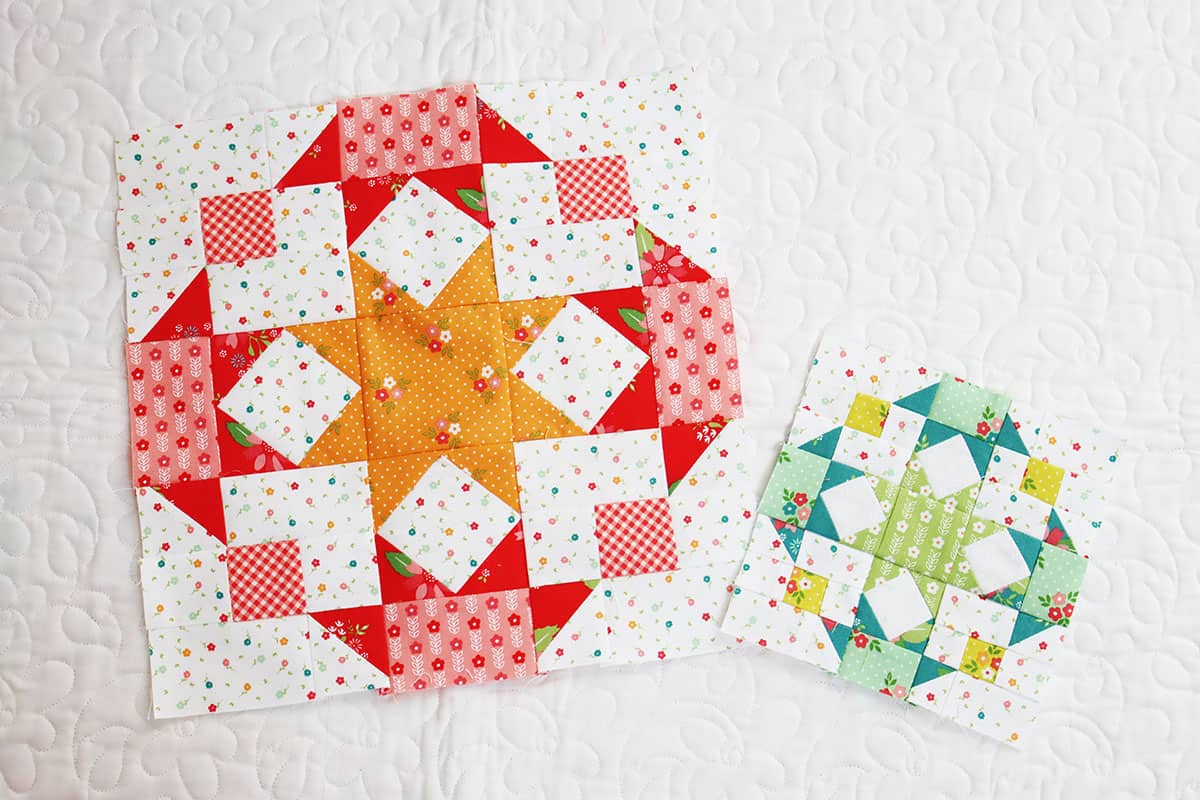 Large and small star design patchwork blocks in bright colors with a center star surrounded by four half star designs.
