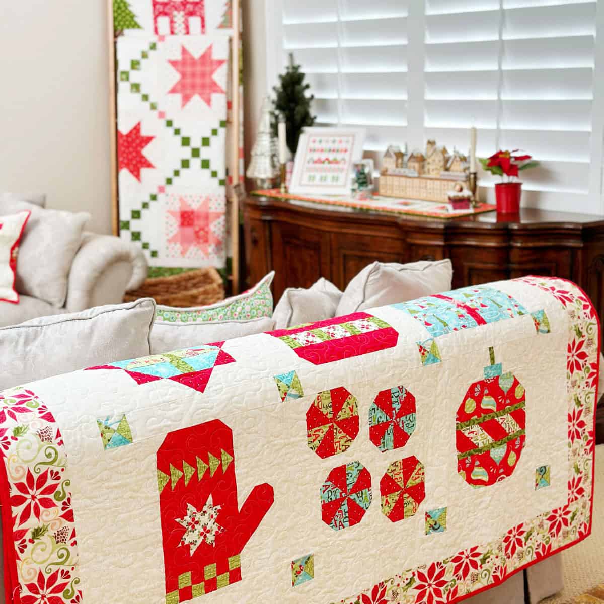 Christmas quilts on ladder and sofa