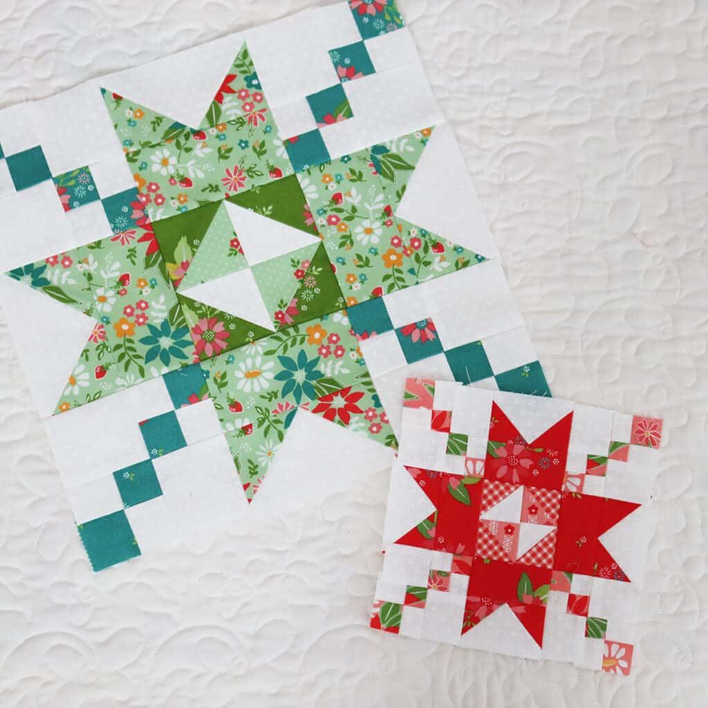Moda Blockheads 5 quilt blocks in red and pink and blue, green, and aqua.