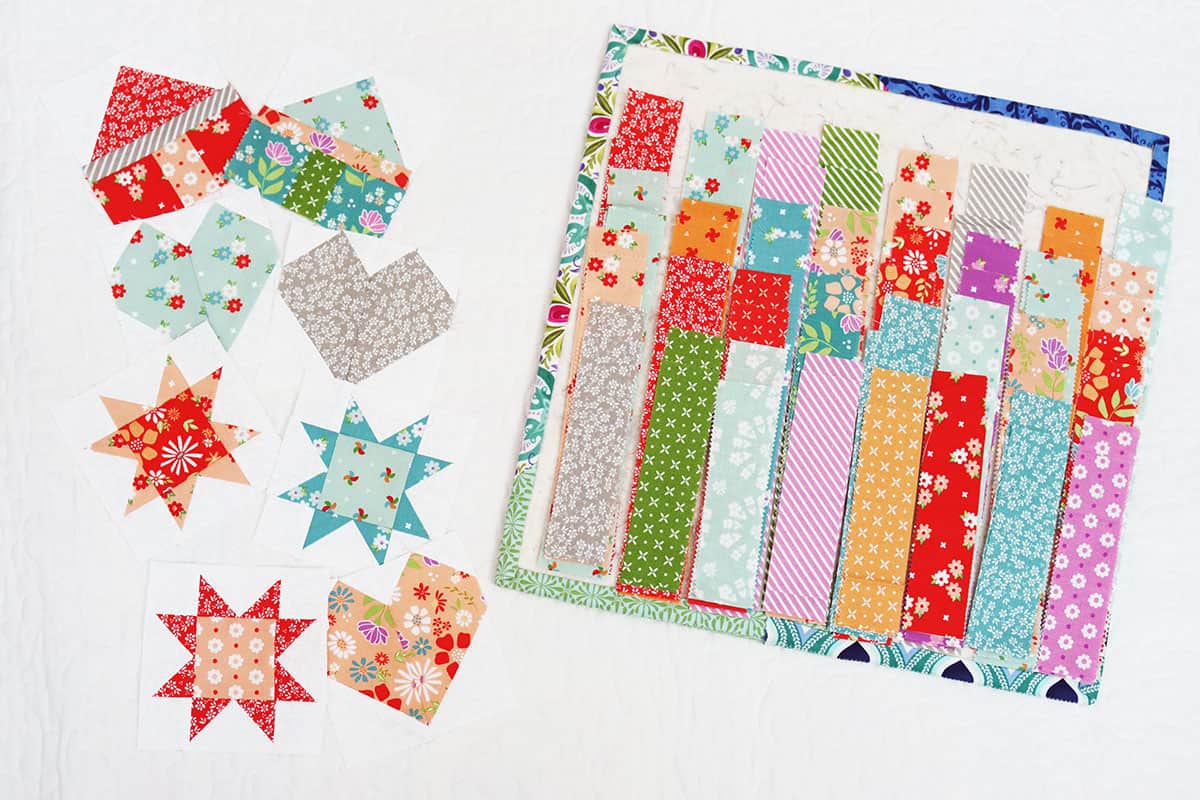 House, heart, and star quilt blocks with brightly colored fabric strips