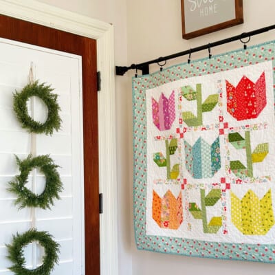 Tulip & Vine Wall Hanging by Sherri McConnell of A Quilting Life