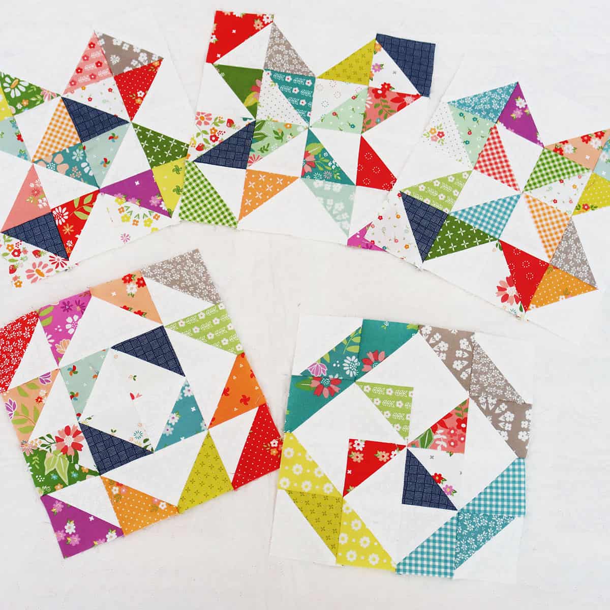 Colorful half square triangle quilt blocks by Sherri from A Quilting Life
