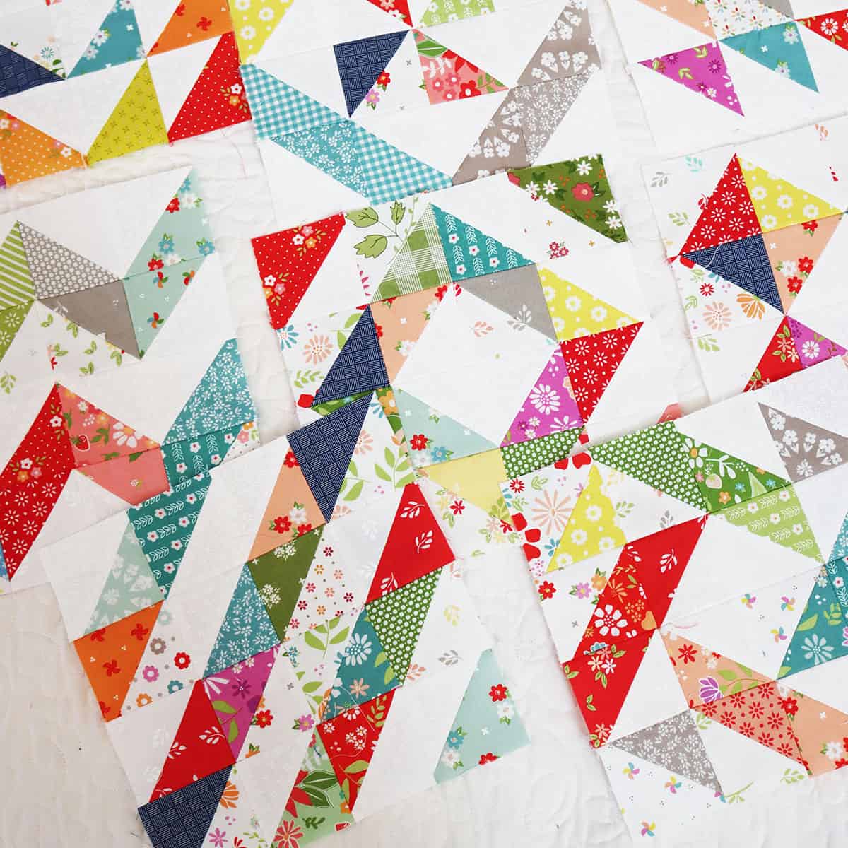 Scrappy Half Square Triangle quilt blocks from Sherri at A Quilting Life