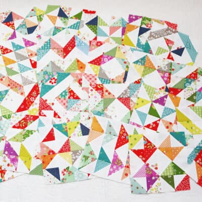 Scrappy half square triangle blocks in fabrics by Sherri & Chelsi