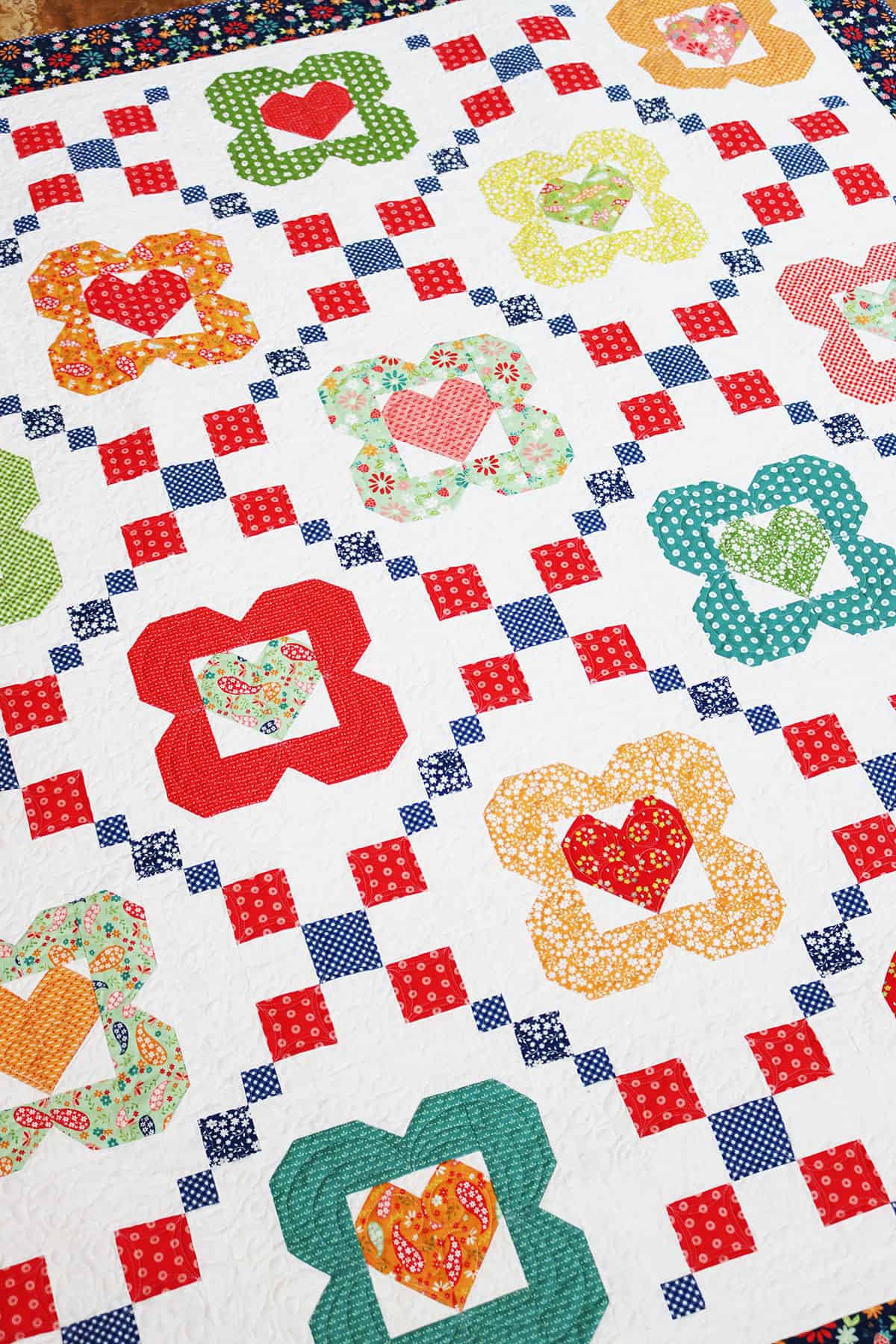 I Heart Flowers quilt in Raspberry Summer fabrics by Sherri from A Quilting Life