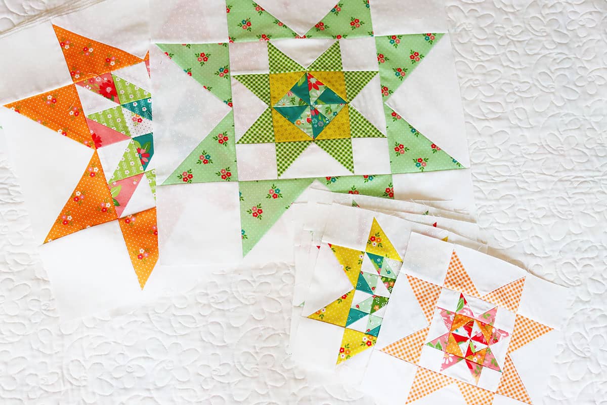 A Quilting Life 2024 Block of the Month blocks by Sherri from A Quilting Life in Strawberry Lemonade fabrics.