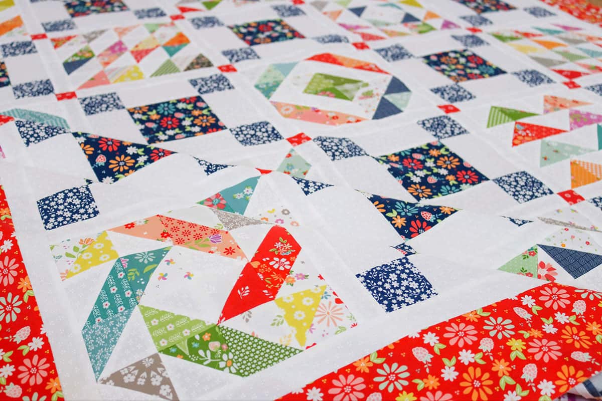 Scrappy Half Square Triangle Quilt by Sherri McConnell at A Quilting Life