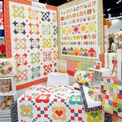 A Quilting Life Raspberry Summer Booth at International Quilt Market in Houston, Texas USA October 2024