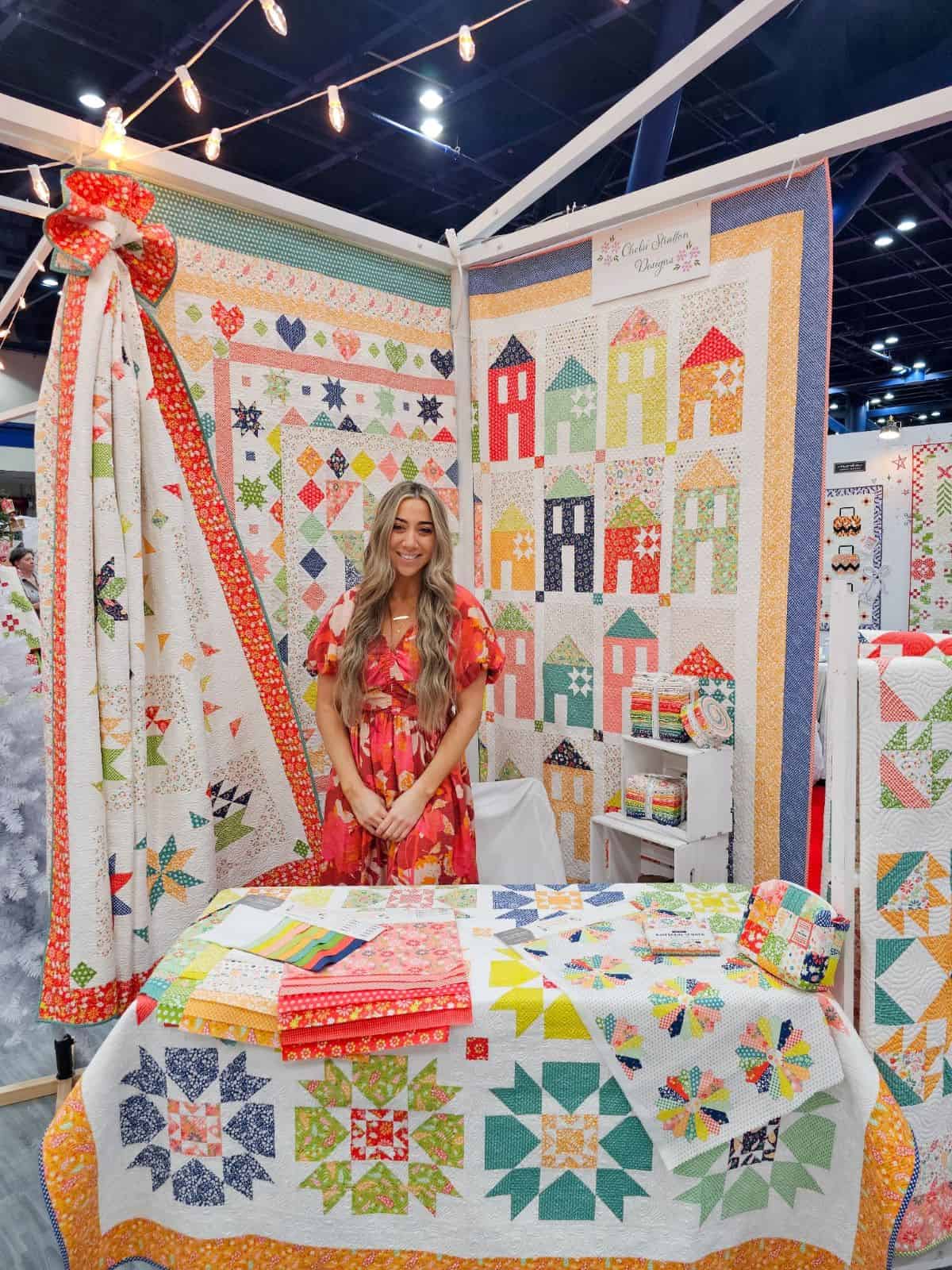 Chelsi Stratton Designs Raspberry Summer collection booth at International Quilt Market in Houston October 2024