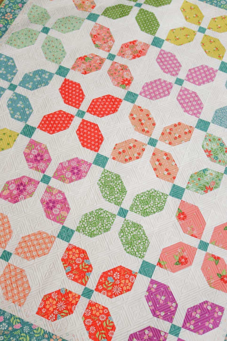 Laguna Stars lap quilt in Strawberry Lemonade, Laguna Sunrise, and Raspberry Summer fabrics by Sherri & Chelsi for Moda Fabrics