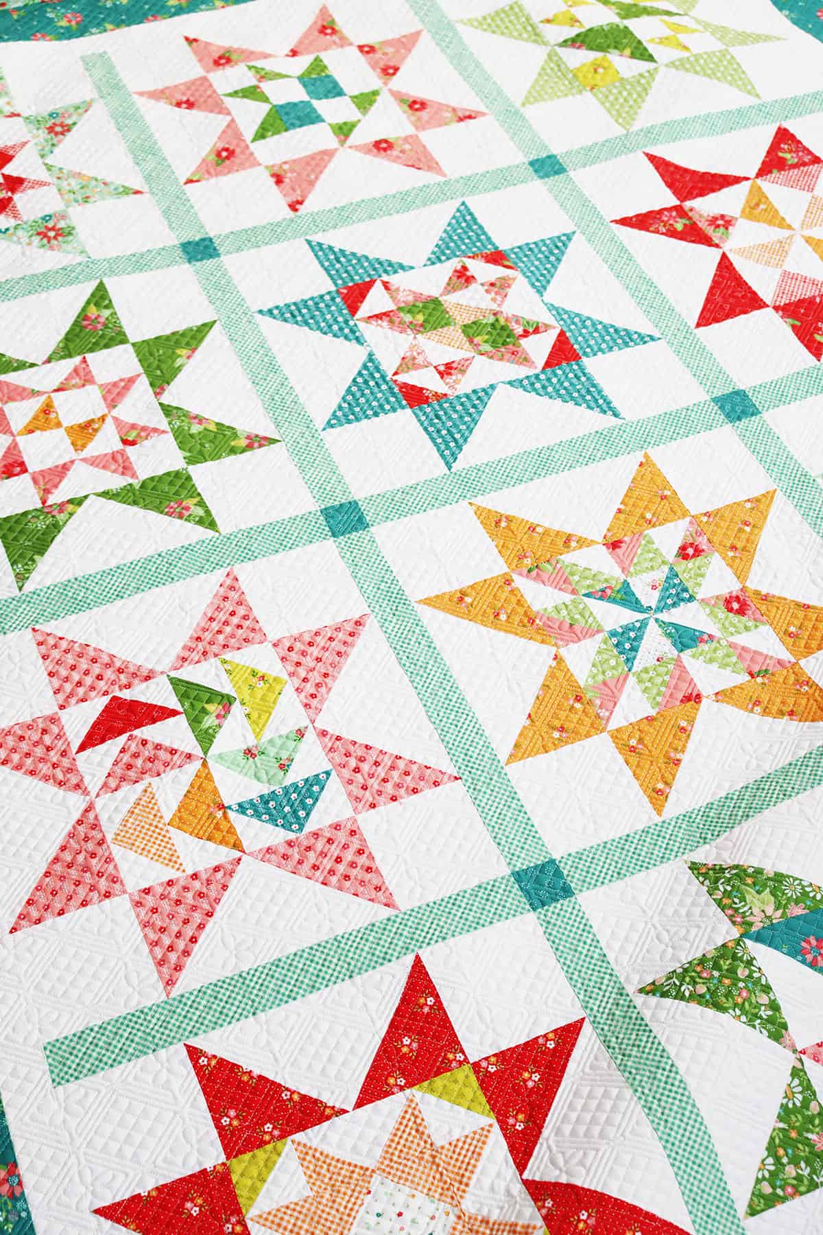 A Quilting Life Block of the Month 2024 finished quilt by Sherri of A Quilting Life in Strawberry Lemonade fabrics
