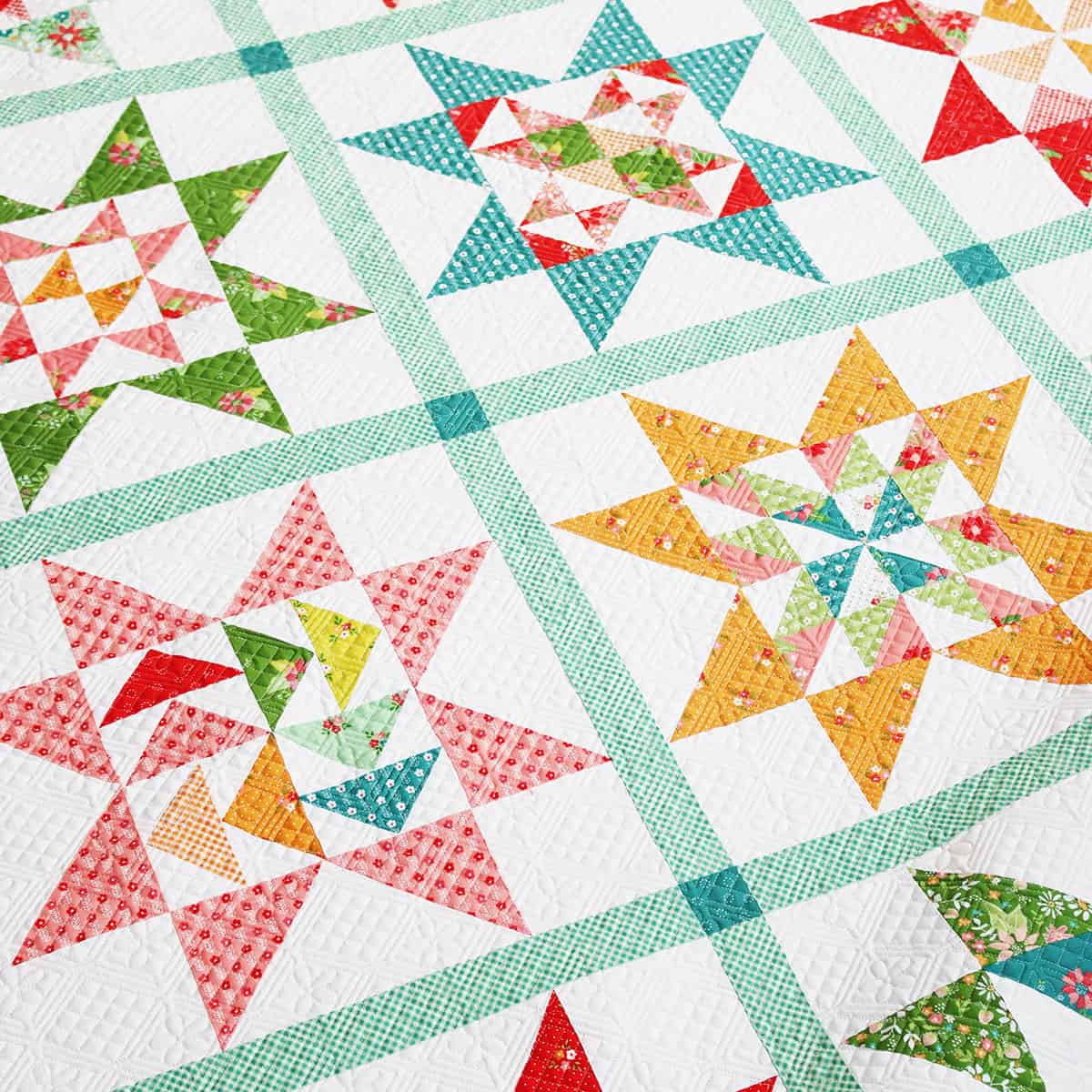 A Quilting Life Block of the Month 2024 finished quilt closeup by Sherri in Strawberry Lemonade fabrics