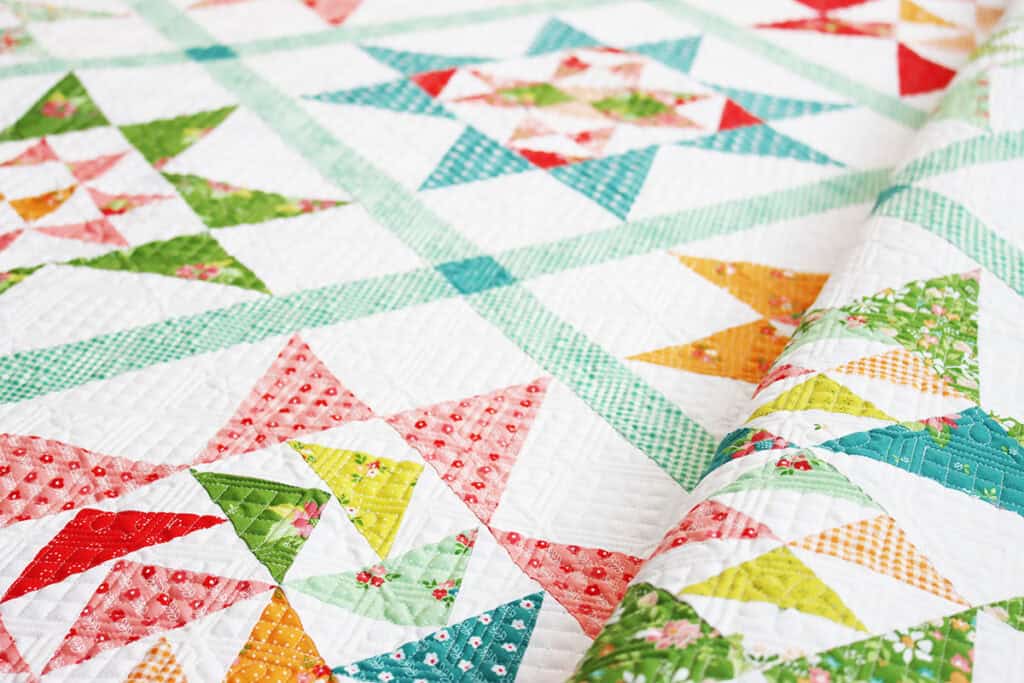 A Quilting Life Block of the Month 2024 finished quilt closeup by Sherri in Strawberry Lemonade fabrics