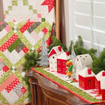 Christmas houses, quilts, and table runner from Sherri at A Quilting Life