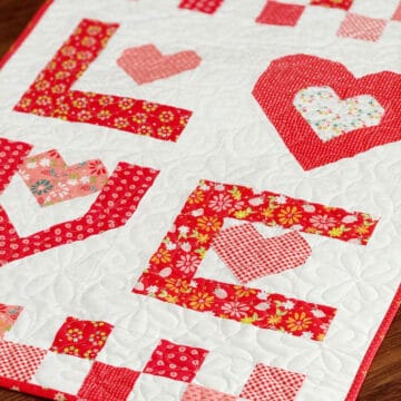 Love Wallhanging in Raspberry Summer fabrics by Sherri & Chelsi