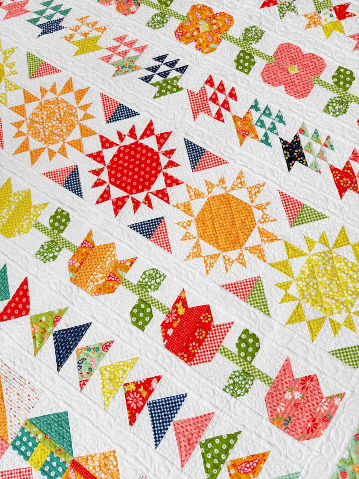 Harbor Row Quilt in Raspberry Summer Fabrics by Sherri from A Quilting Life