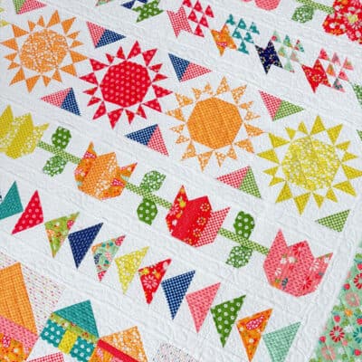 Harbor Row Quilt in Raspberry Summer Fabrics by Sherri from A Quilting Life