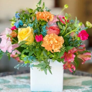 Flowers on a quilted table topper from Sherri at A Quilting Life