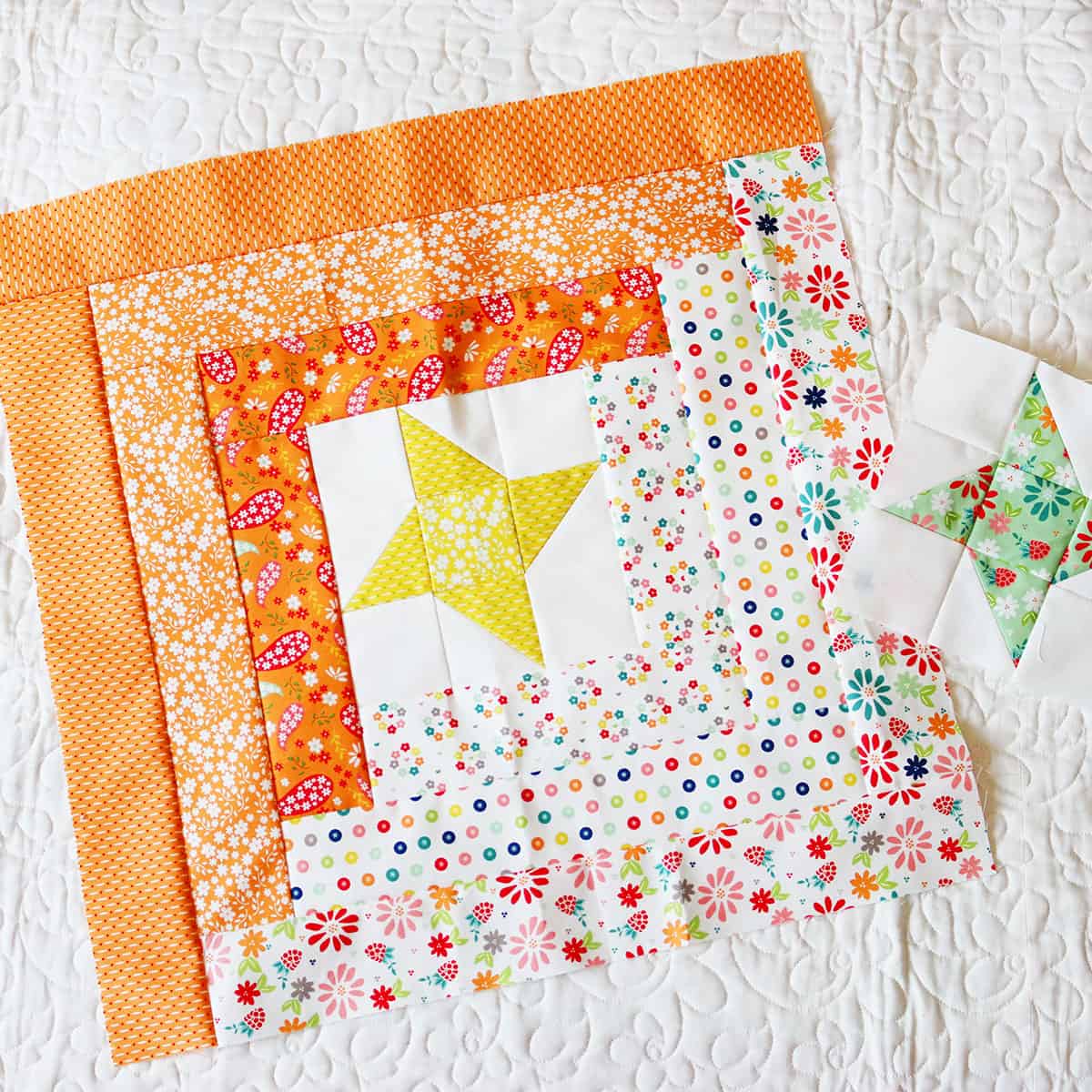 A Quilting Life Block of the Month blocks for June in Raspberry Summer fabrics.