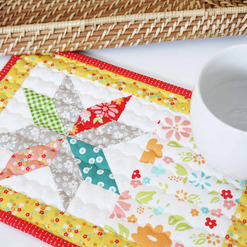 Mid-Summer Star Mug Rug by Sherri McConnell of A Quilting Life