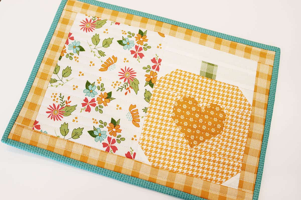 Pumpkin Table Mat by Sherri McConnell of A Quilting Life