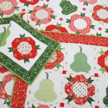 Posies & Pears Quilt, Wall Hanging, and Table Runner in Poinsettia & Pear fabrics by Sherri & Chelsi for Moda fabrics