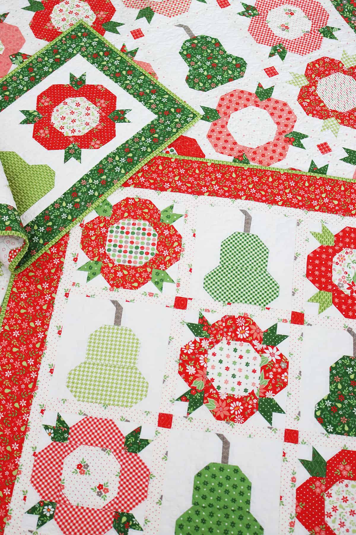 Posies & Pears Quilt, Wall Hanging, and Table Runner in Poinsettia & Pear fabrics by Sherri & Chelsi for Moda fabrics