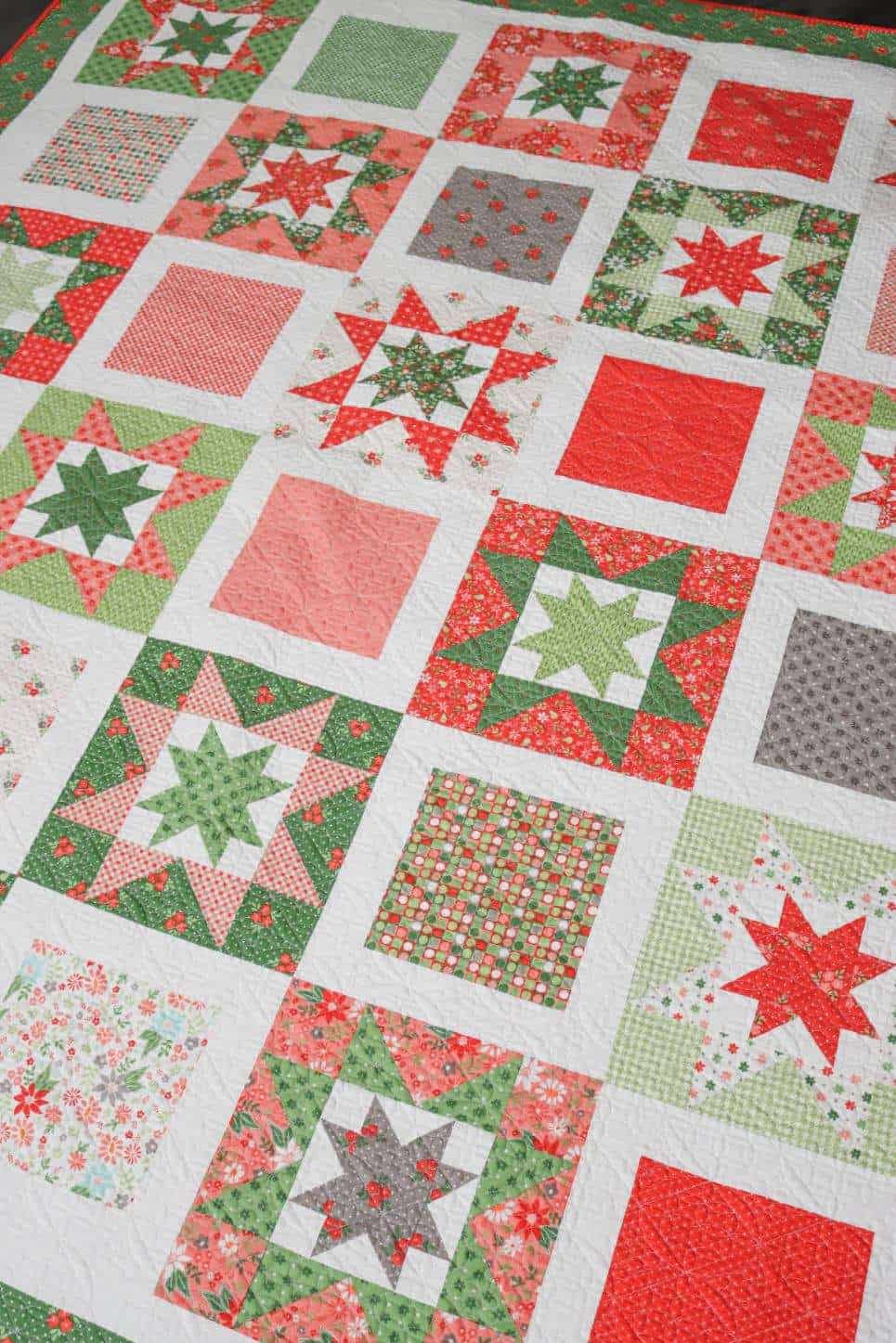 Whimsy Stars quilt in Poinsettia & Pear Fabrics by Sherri of A Quilting Life