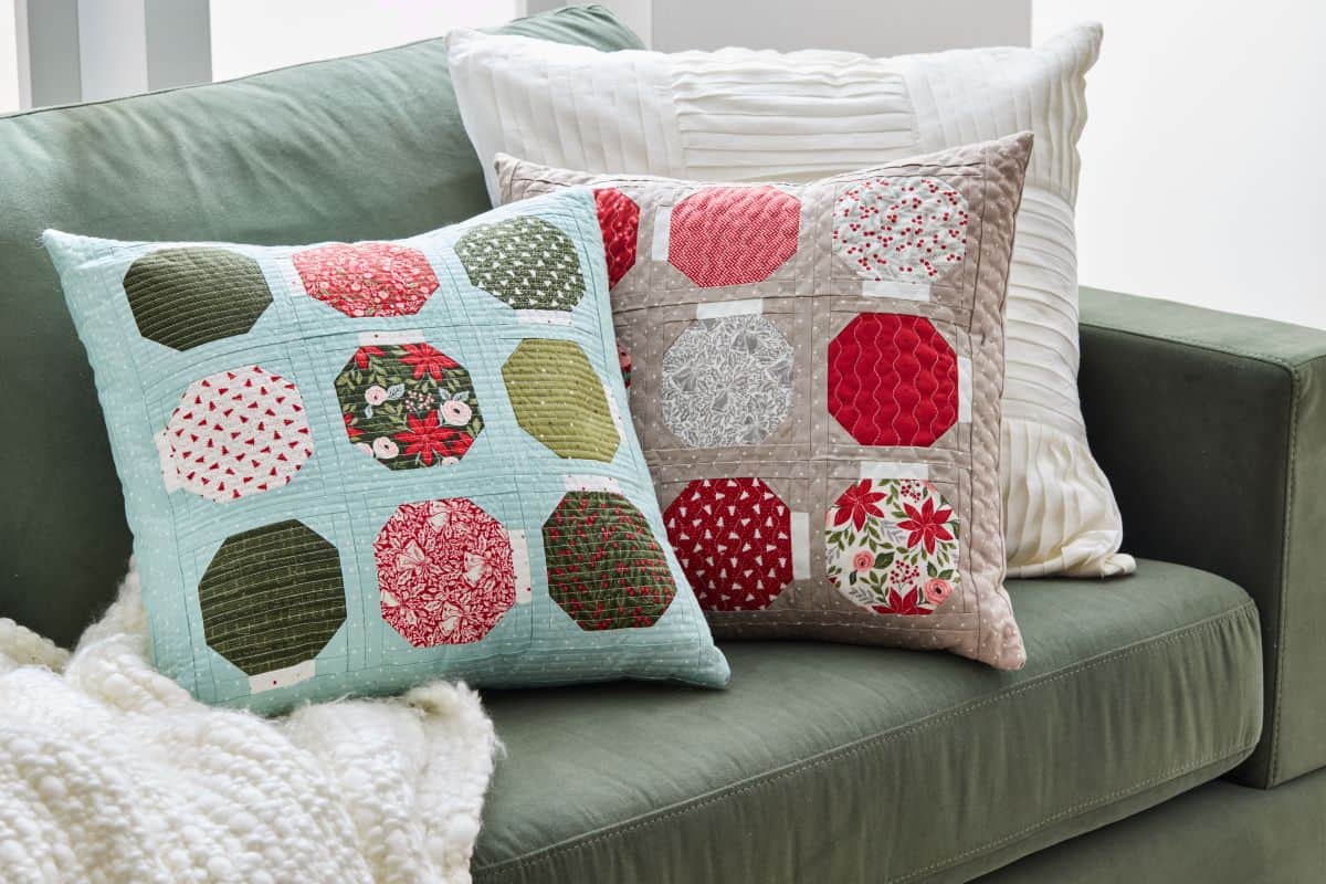 Ornament Box pillows in Berry & Pine by Lella Boutique for Moda Fabrics. Used with permission from American Patchwork & Quilting® magazine. ©2025 Meredith Operations Corporation. All rights reserved.
