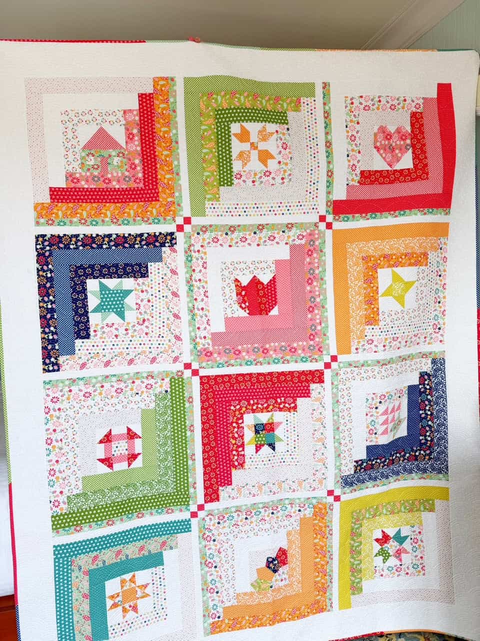 A Quilting Life 2025 BOM Quilt in Raspberry Summer Fabrics for Moda