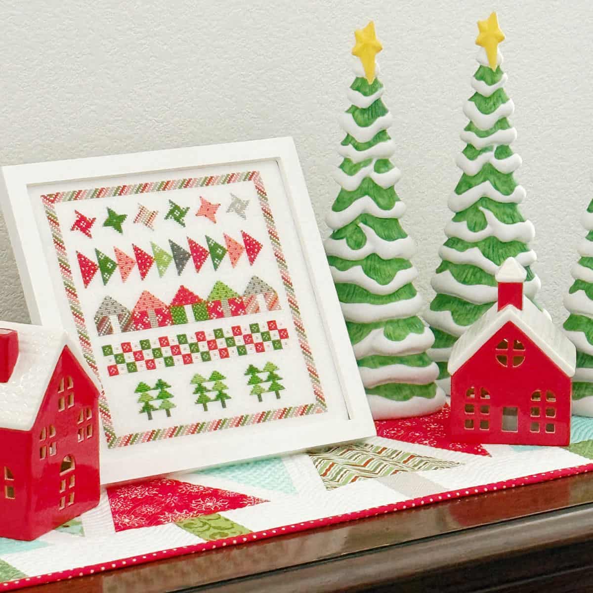 A Quilting Life Ceramic trees and houses with cross stitch and tree table runner