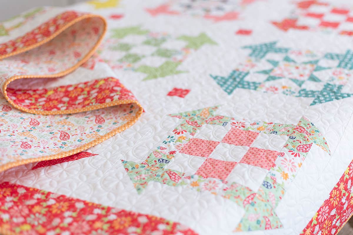 Fireflies Quilt in Raspberry Summer Fabrics by Sherri McConnell of A Quilting Life
