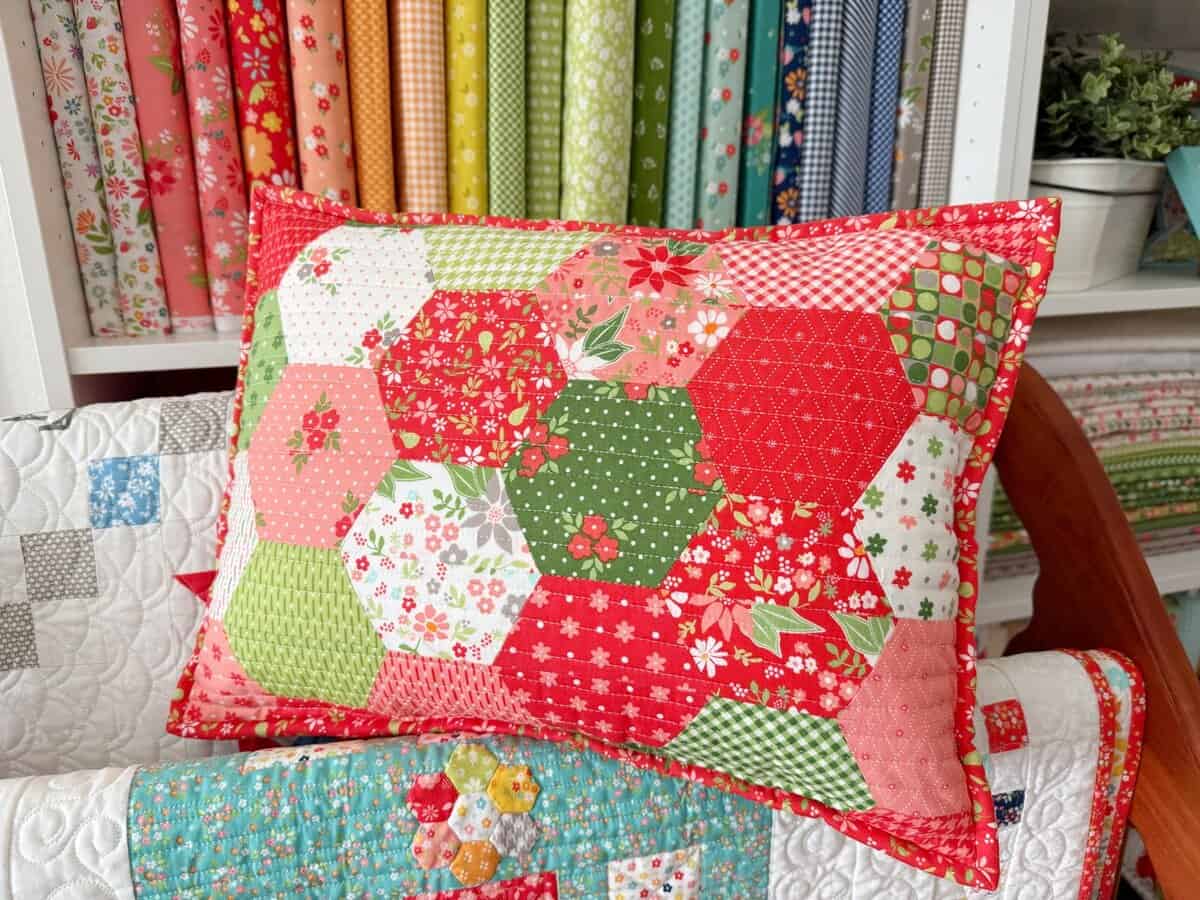 Half-Hexagon Pillow in Poinsettia & Pear Fabrics by Sherri & Chelsi for Moda Fabrics
