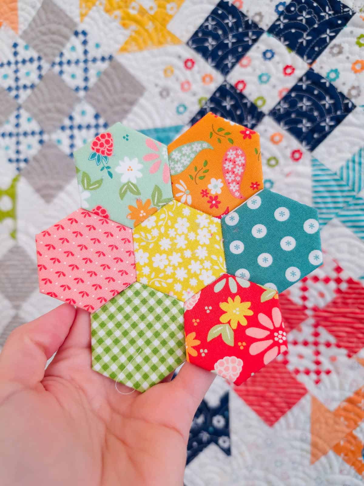 Hexagon Flower in fabrics by Sherri & Chelsi for Moda Fabrics