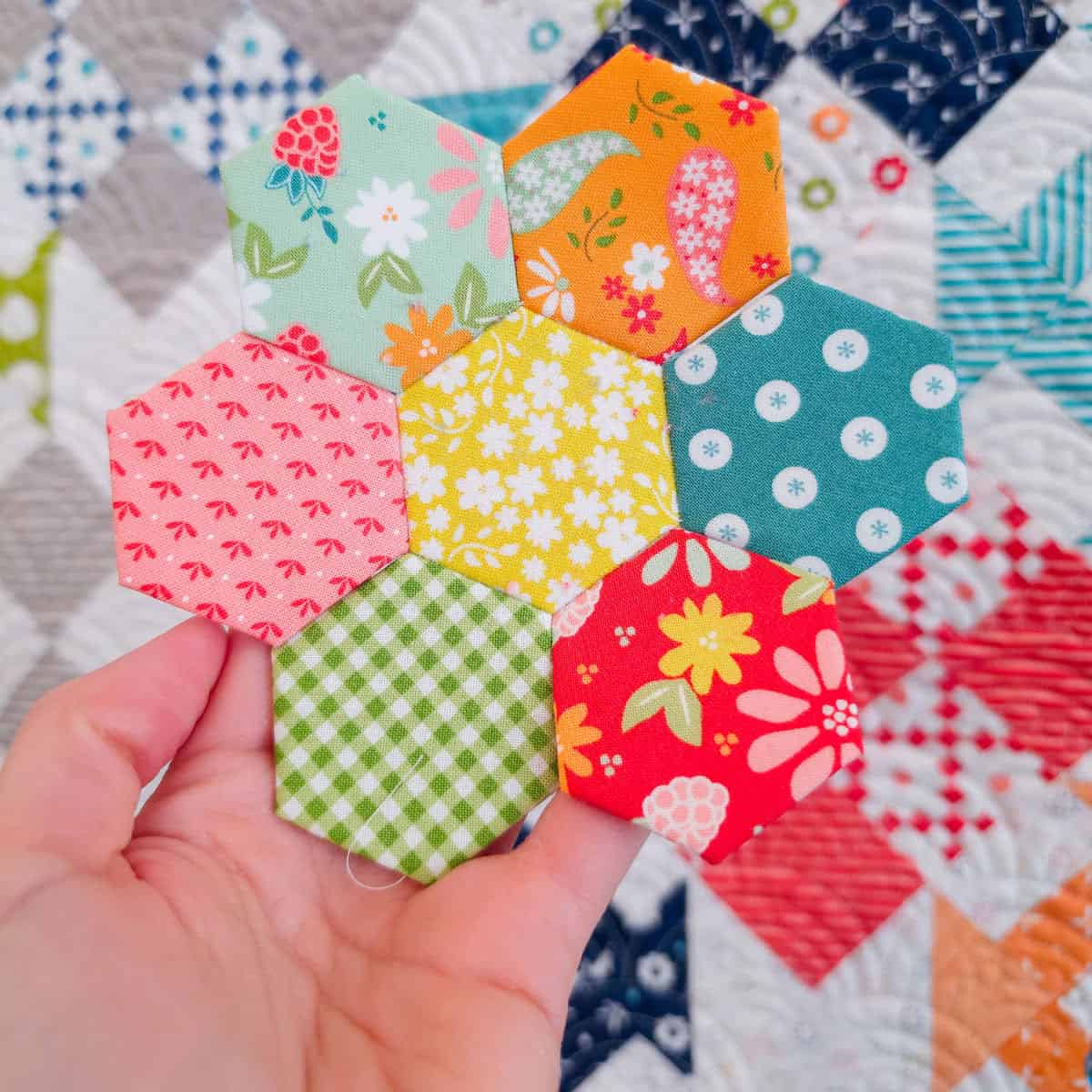 Hexagon Flower in fabrics by Sherri & Chelsi for Moda Fabrics