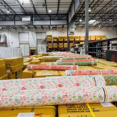 Poinsettia & Pear fabrics ready to be rolled onto bolts