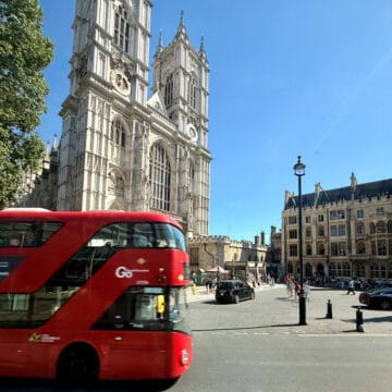 Red Bus on city street in England 2026